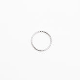 Silver ring on a white background, close up top view